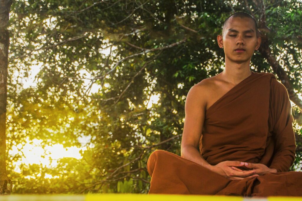 Spiritual moment of monk praying in Chandragiri Odisha monastery